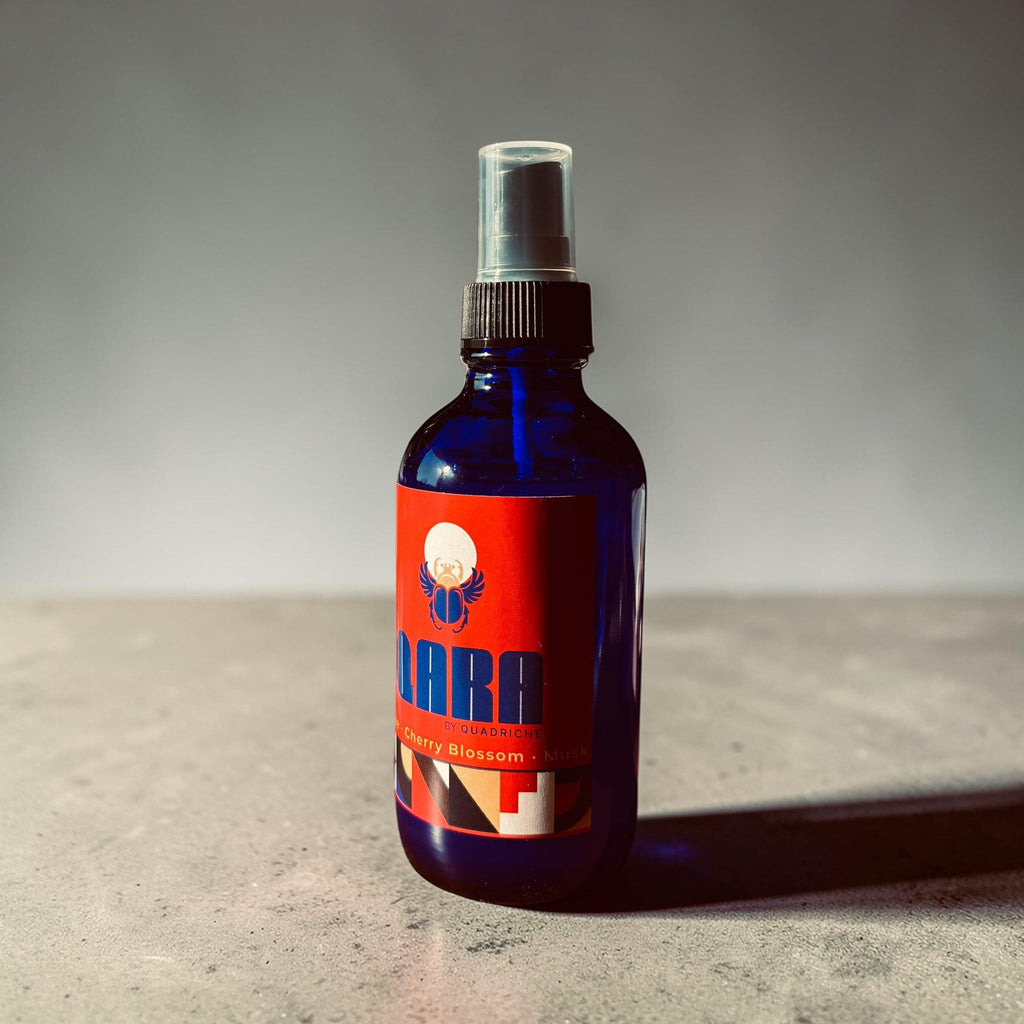Ambrosia by Quadriche cherry blossom scented room and linen spray in a cobalt blue glass spray bottle 