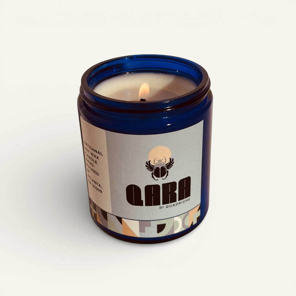 Candle in a blue jar with a label on a white background