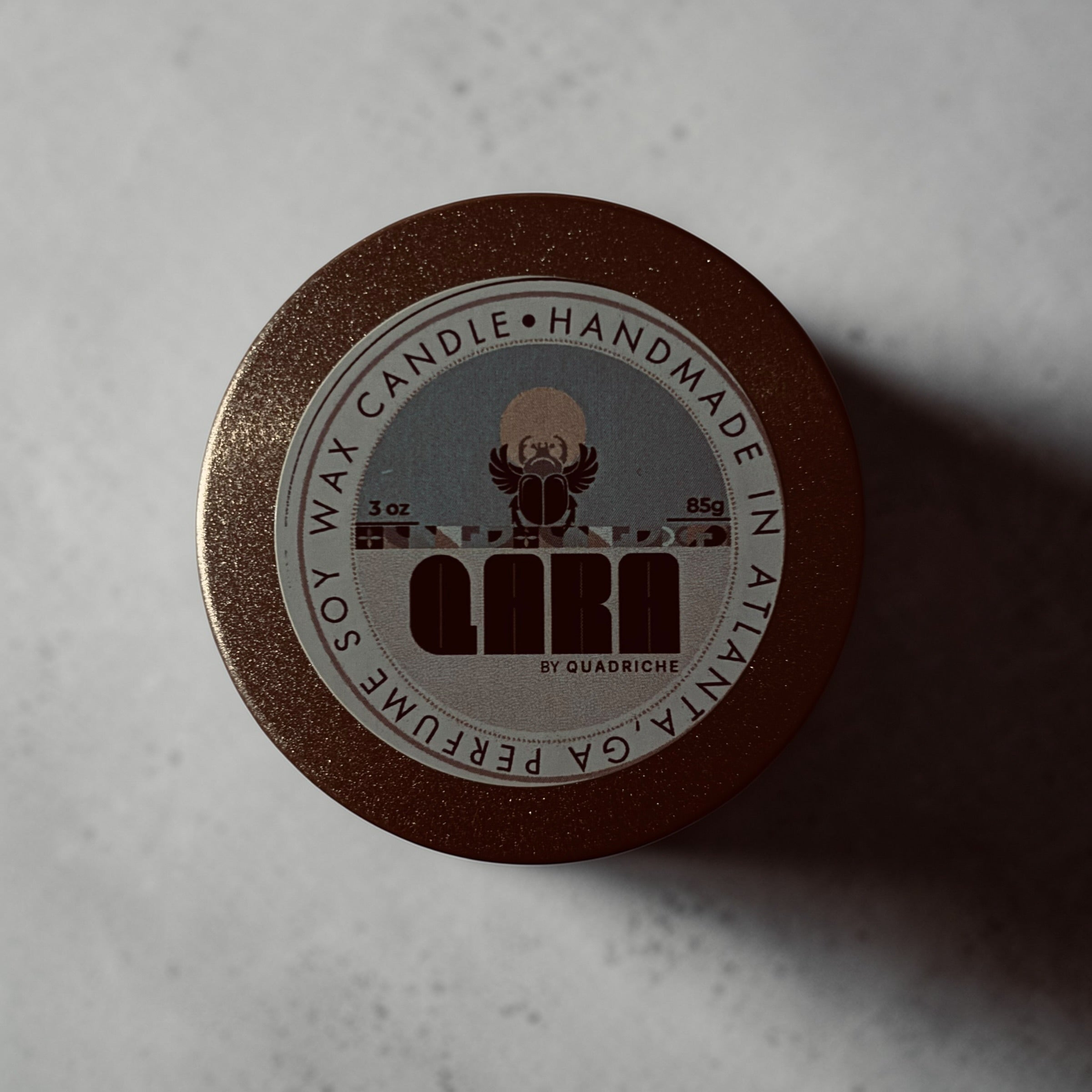 Dew Discovery Travel 3oz Candle in a tin with a label on a concrete surface ozone apple eucalyptus scent 