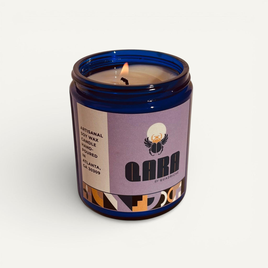 Candle in a blue jar with a purple label on a white background
