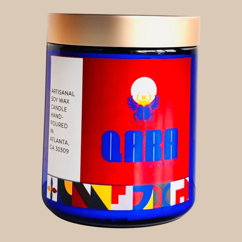 Candle jar with a colorful label on a beige background  QARA by Quadriche scented perfume candle AMBROSIA Cherry Blossom Fruit scent candle soy wax and coconut cotton wick