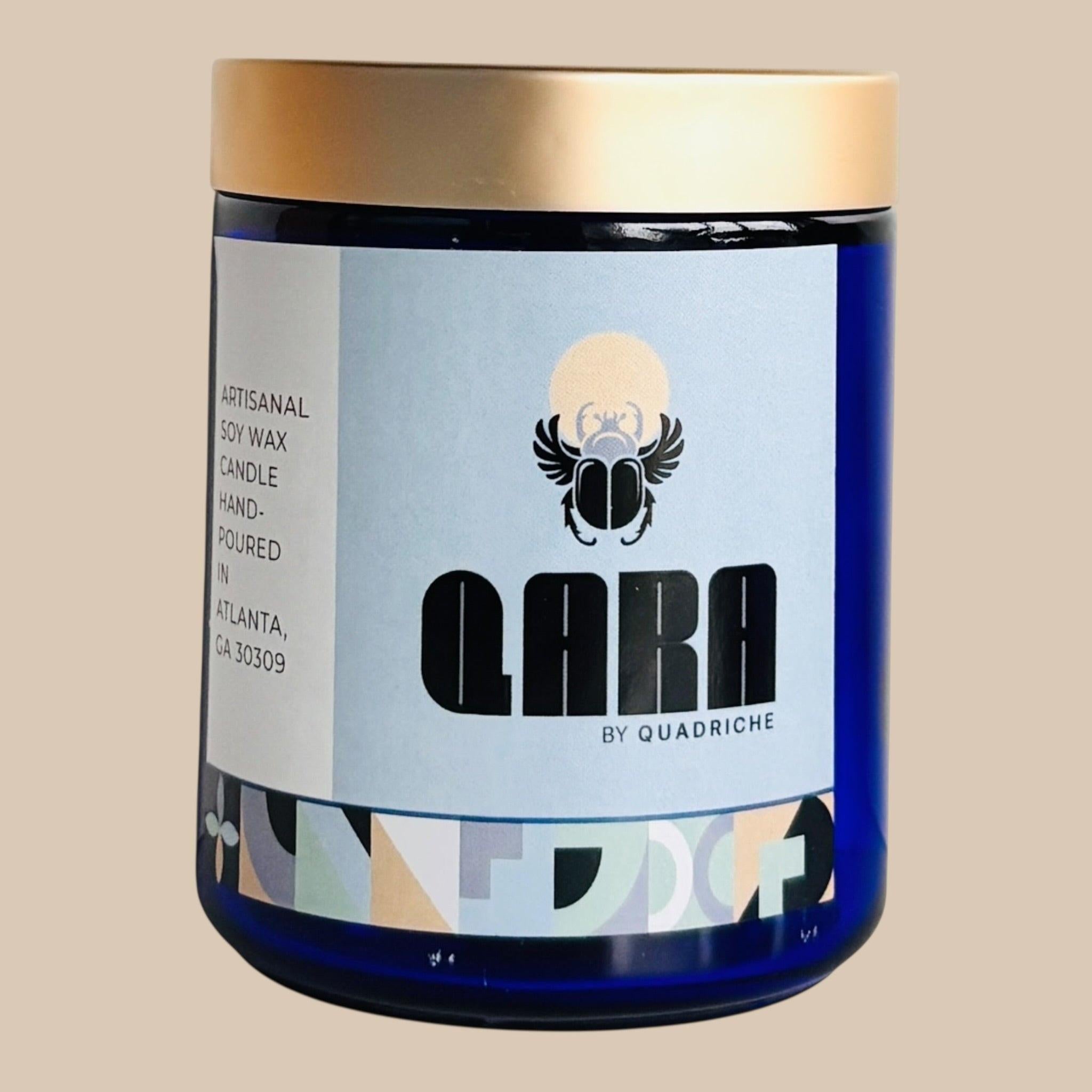 Candle jar with 'Qara by Quadriche' Dew scent-fresh and ozonous paired with apples
