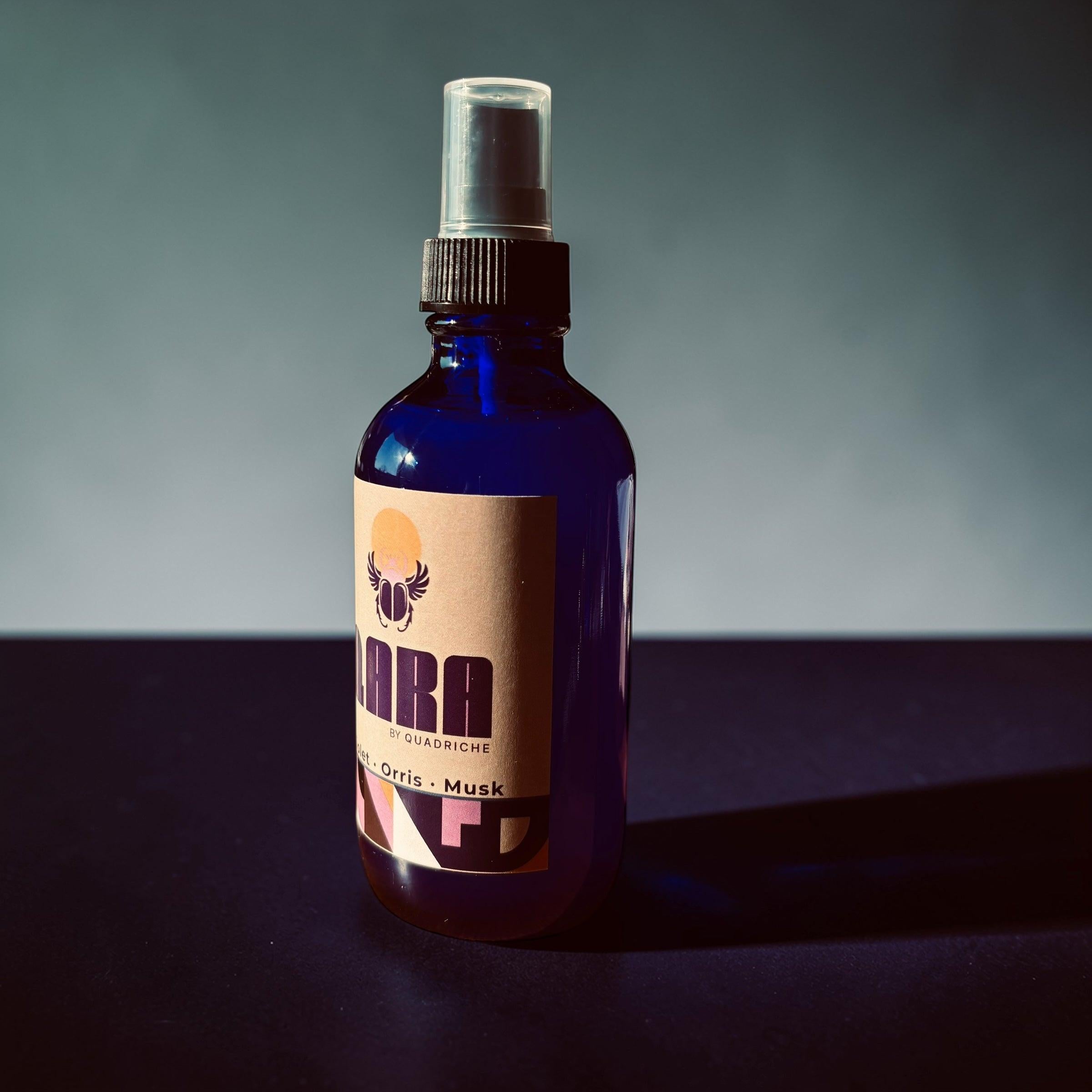 QARA by Quadriche Violet Ember Room & Linen Spray in cobalt blue glass