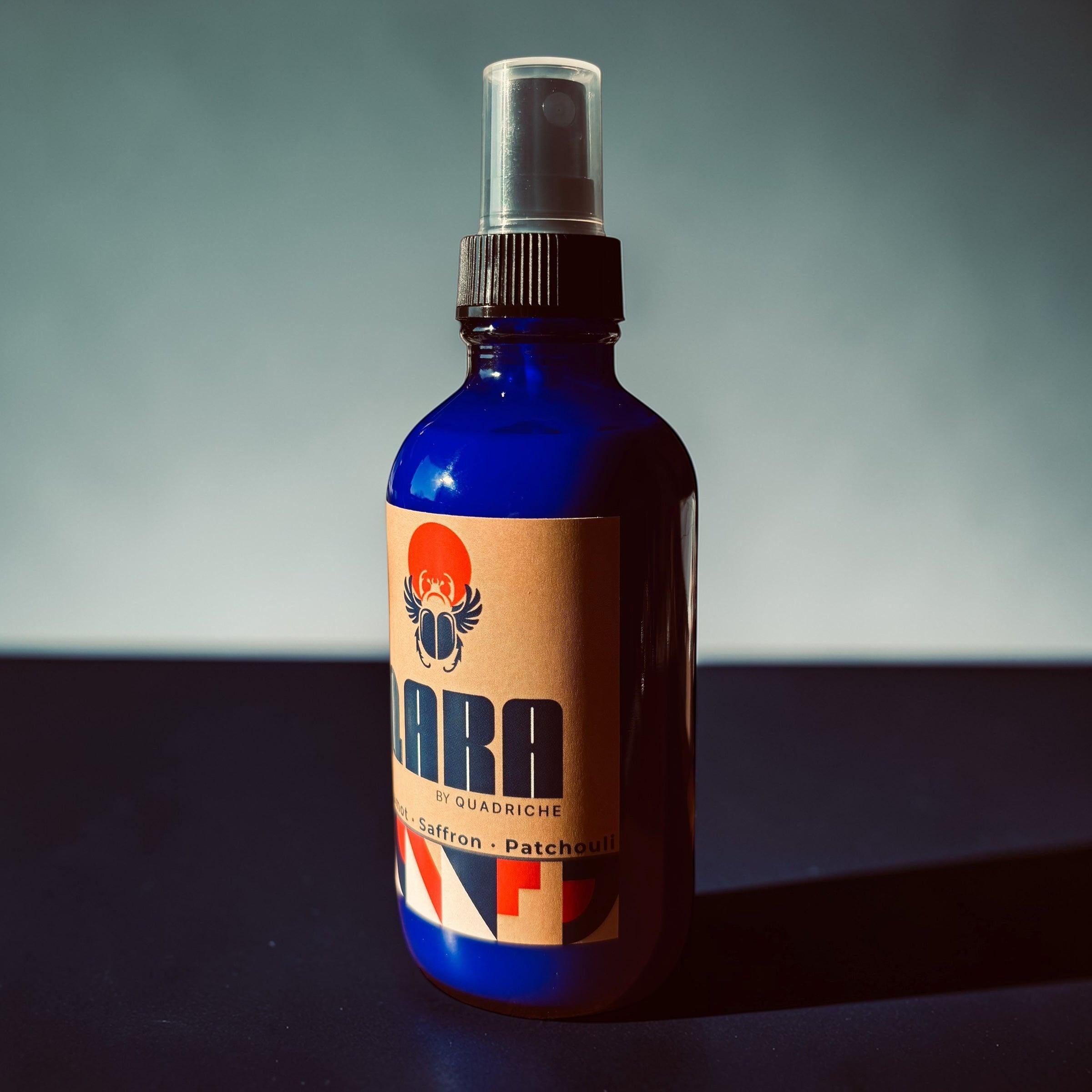 Souks of Marrakesh QARA by Quadriche bergamot scented room and linen spray in a cobalt blue glass spray bottle 