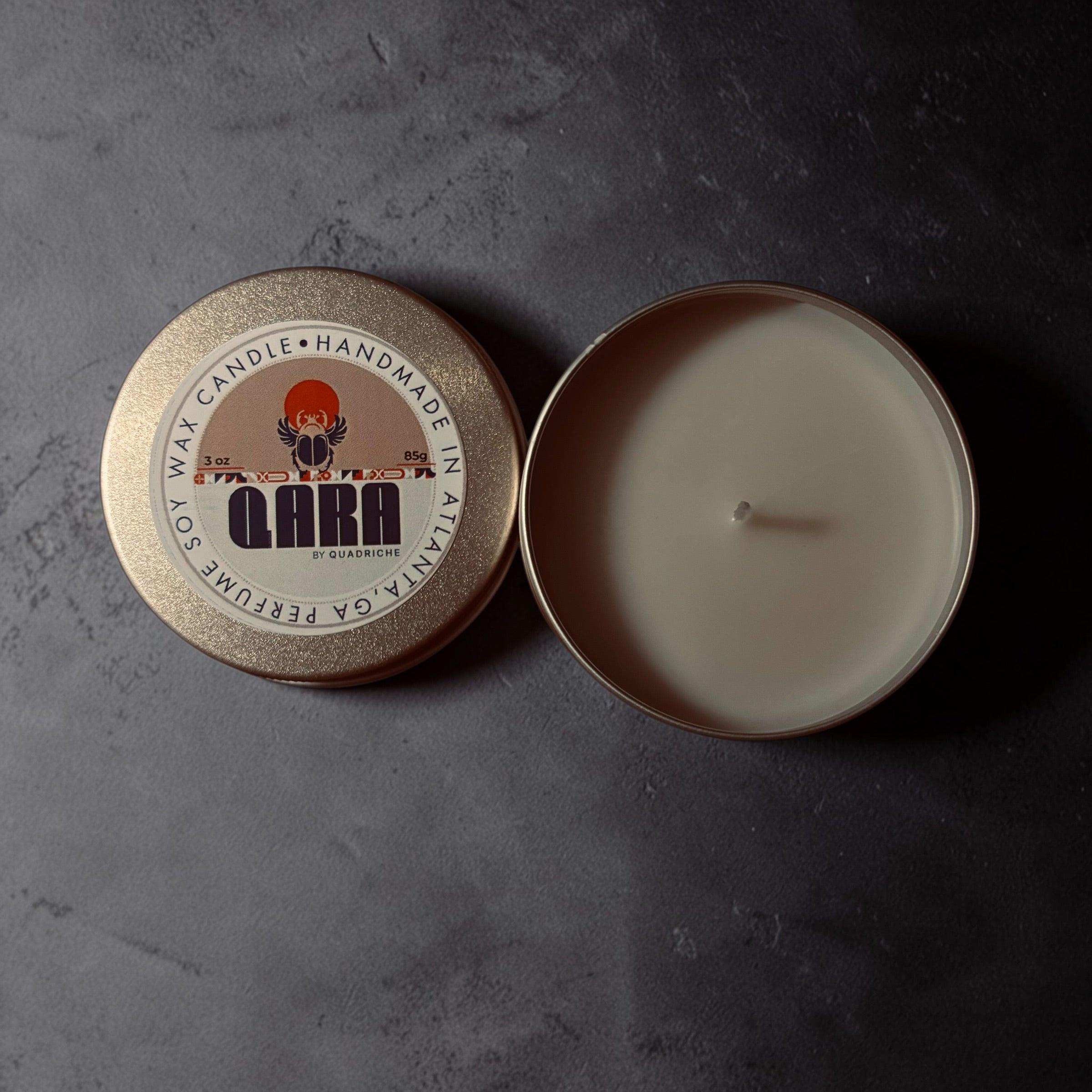 Souks of Marrakesh scented candle in a champagne gold tin with a visible brand label on a dark surface