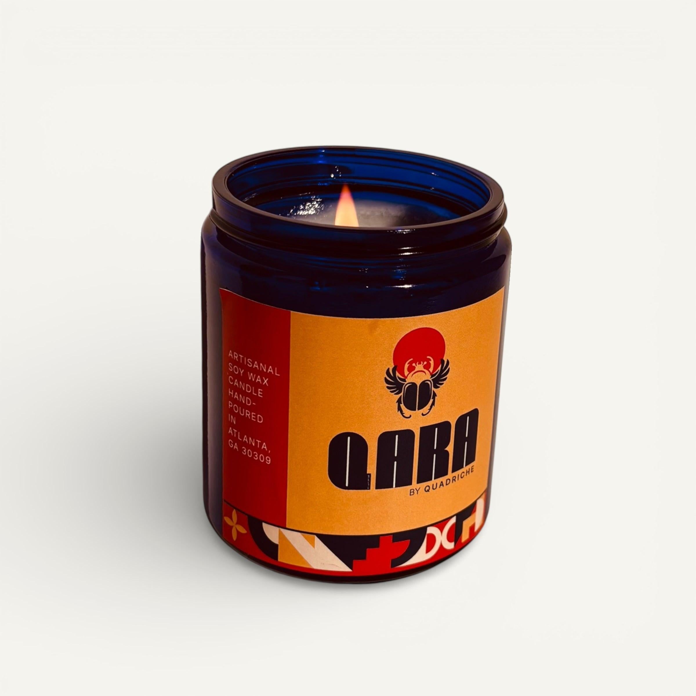 Candle in a decorative jar with a colorful label on a white background