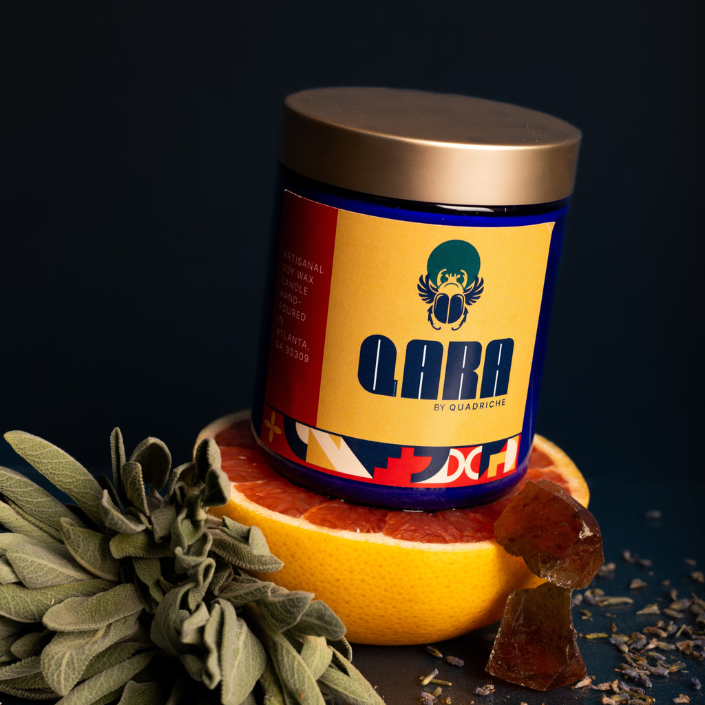 Māori Forest scented soy candle in cobalt glass shown at angle – grapefruit, sage and amber home fragrance by Quadriche Atlanta