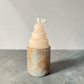 Concrete candle with low rounded shape and textured gold-accented base, mixed media soy wax and concrete candle handcrafted in Atlanta front view
