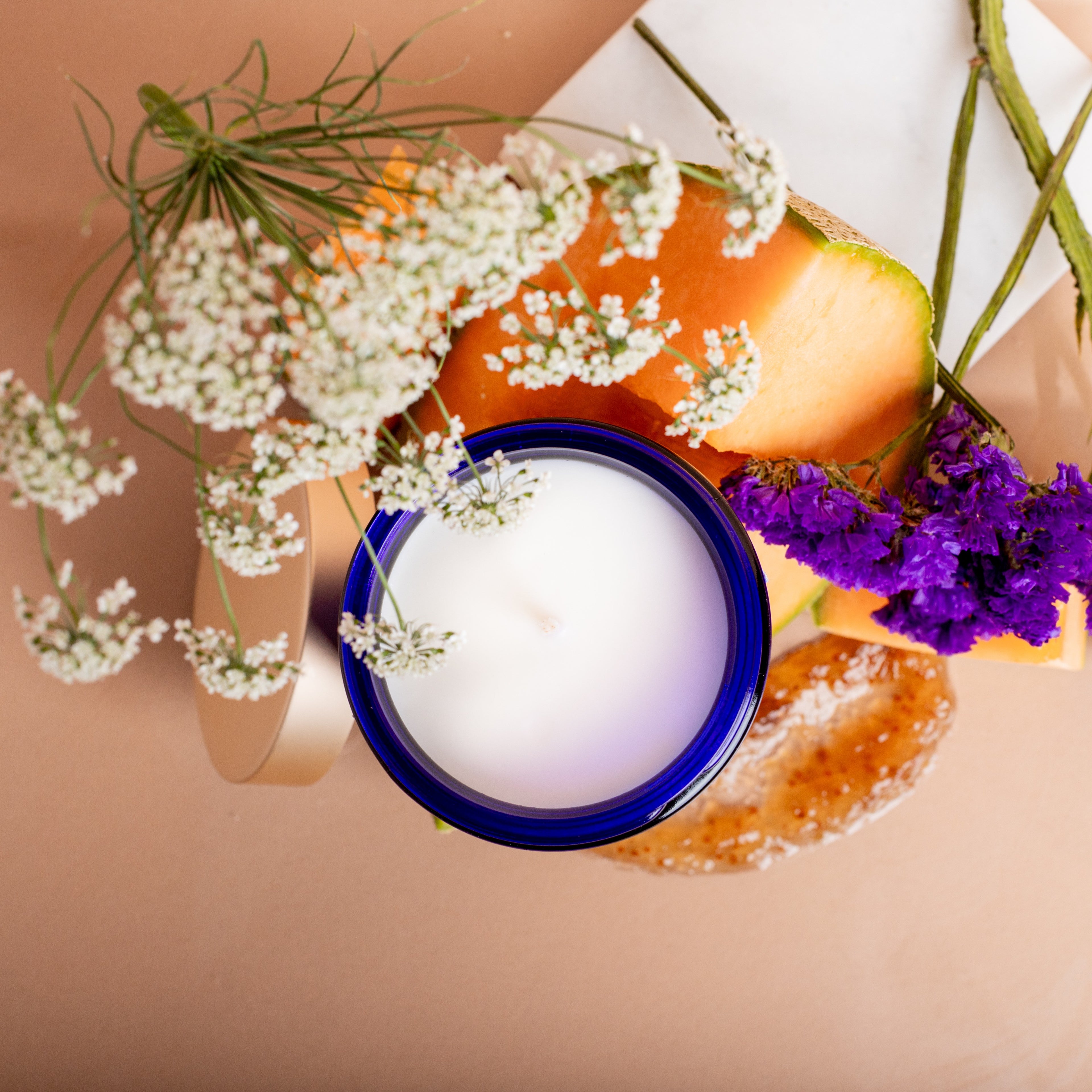 Top view of Violet Ember soy candle with smooth clean-burning wax in cobalt glass – luxury home fragrance by Quadriche Atlanta